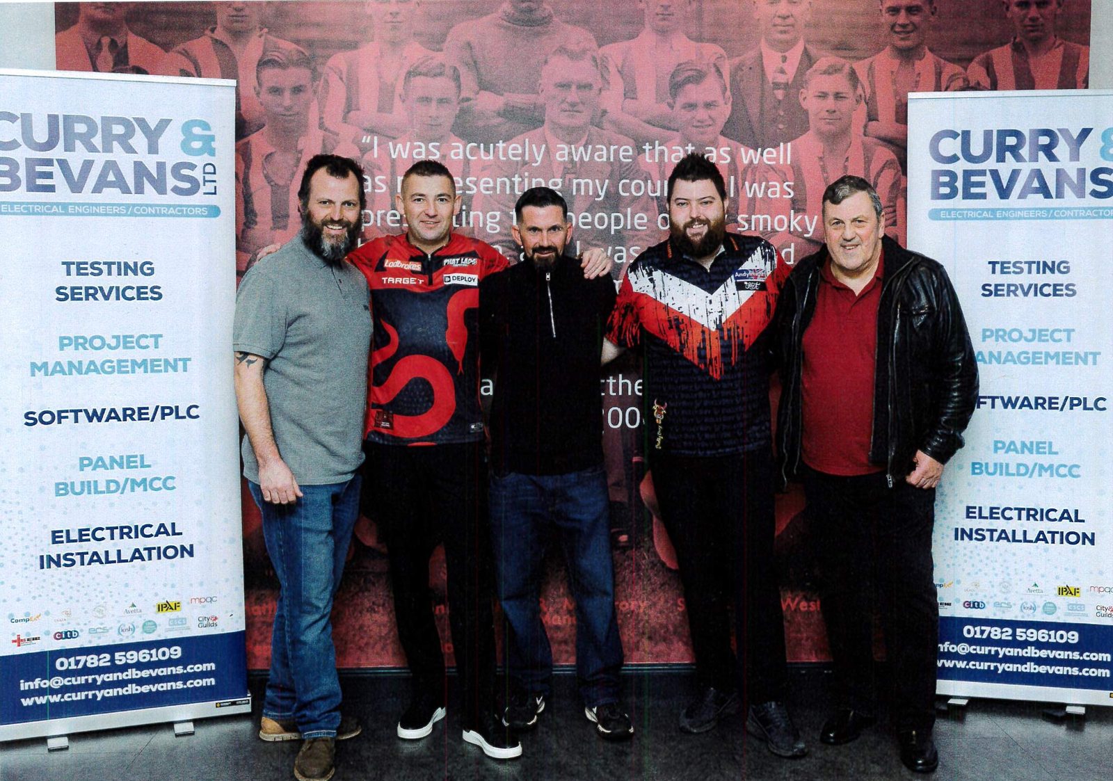 The Curry and Bevans Ltd. team at a darts event