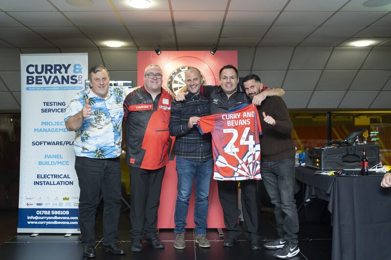 The Curry and Bevans Ltd. team at a darts event